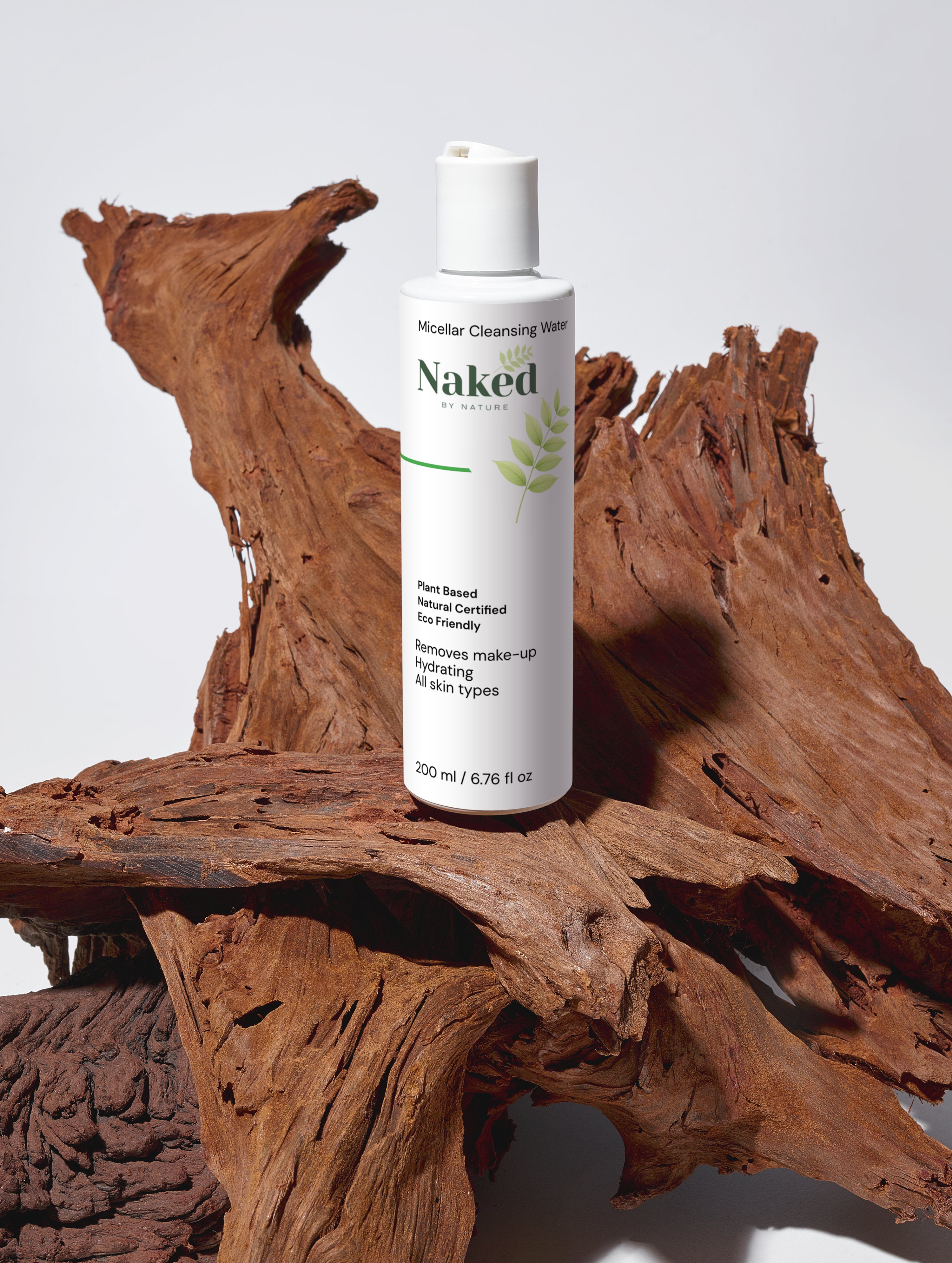 Naked by Nature Micellar Cleansing Water, plant-based, hydrating, for all skin types, on rustic wood