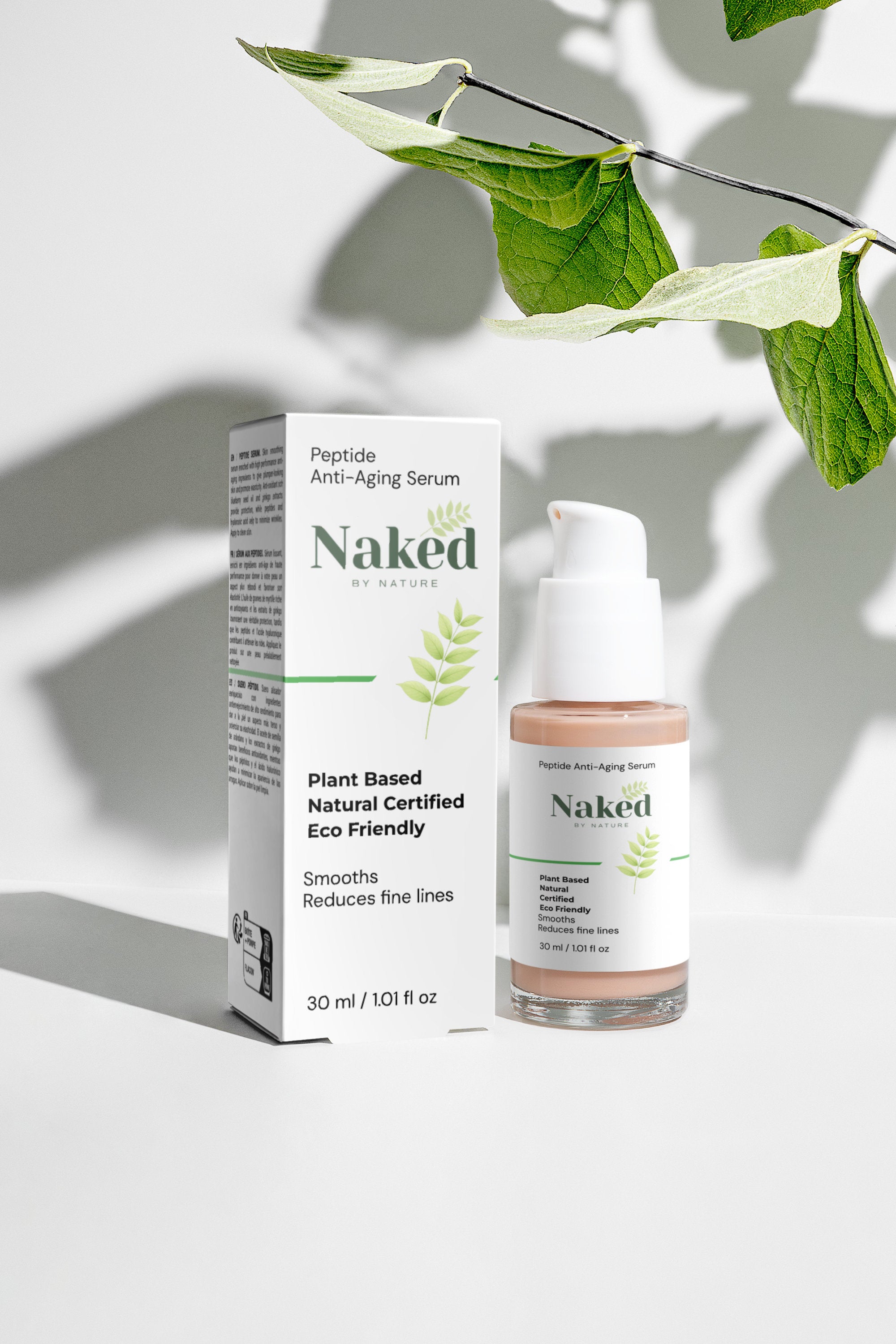 Plant-based peptide anti-aging serum in glass bottle with pump, beside box, under green leaves