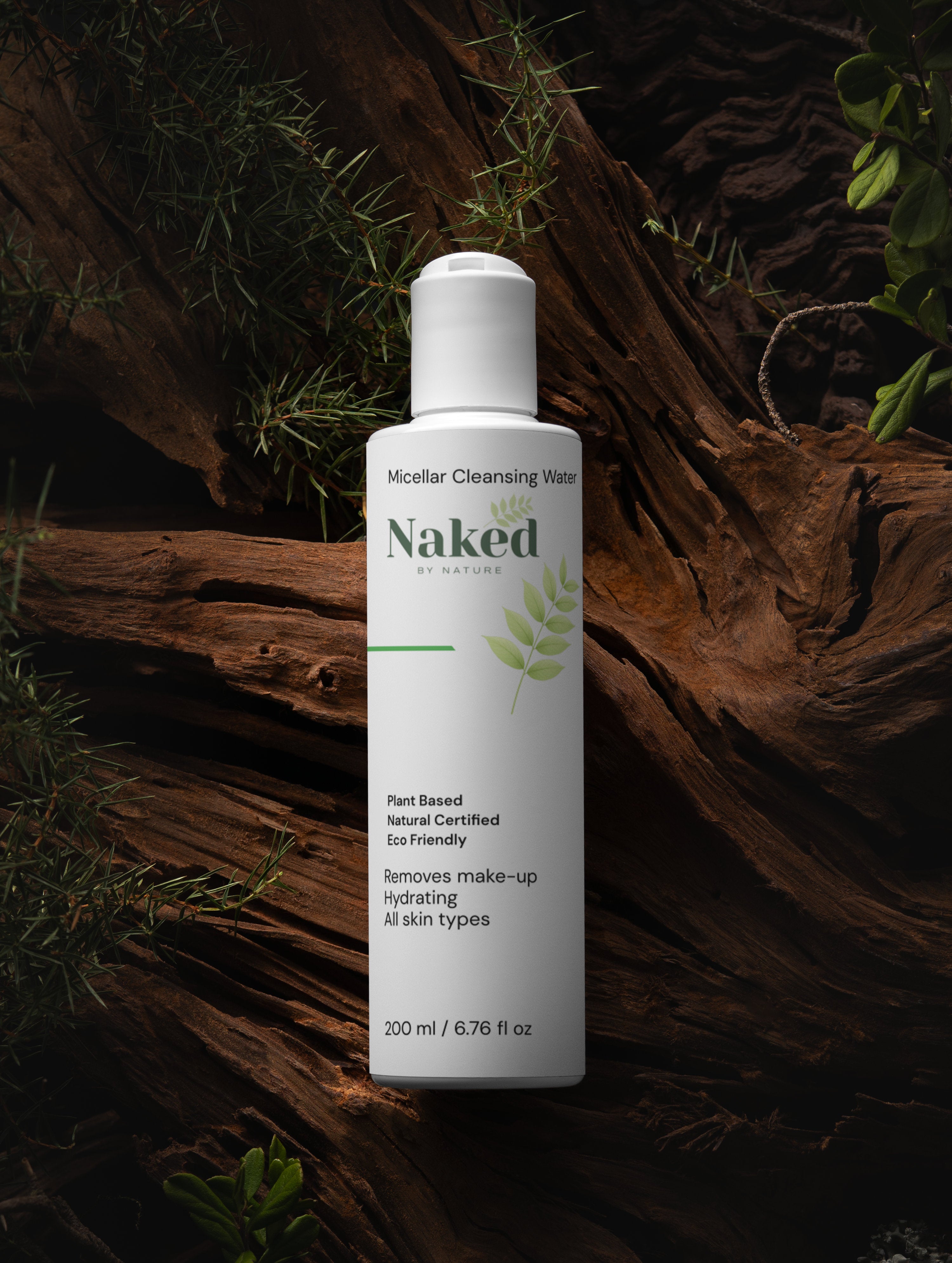 Micellar Cleansing Water bottle on rustic wood with greenery, plant-based, hydrating, eco-friendly for all skin types