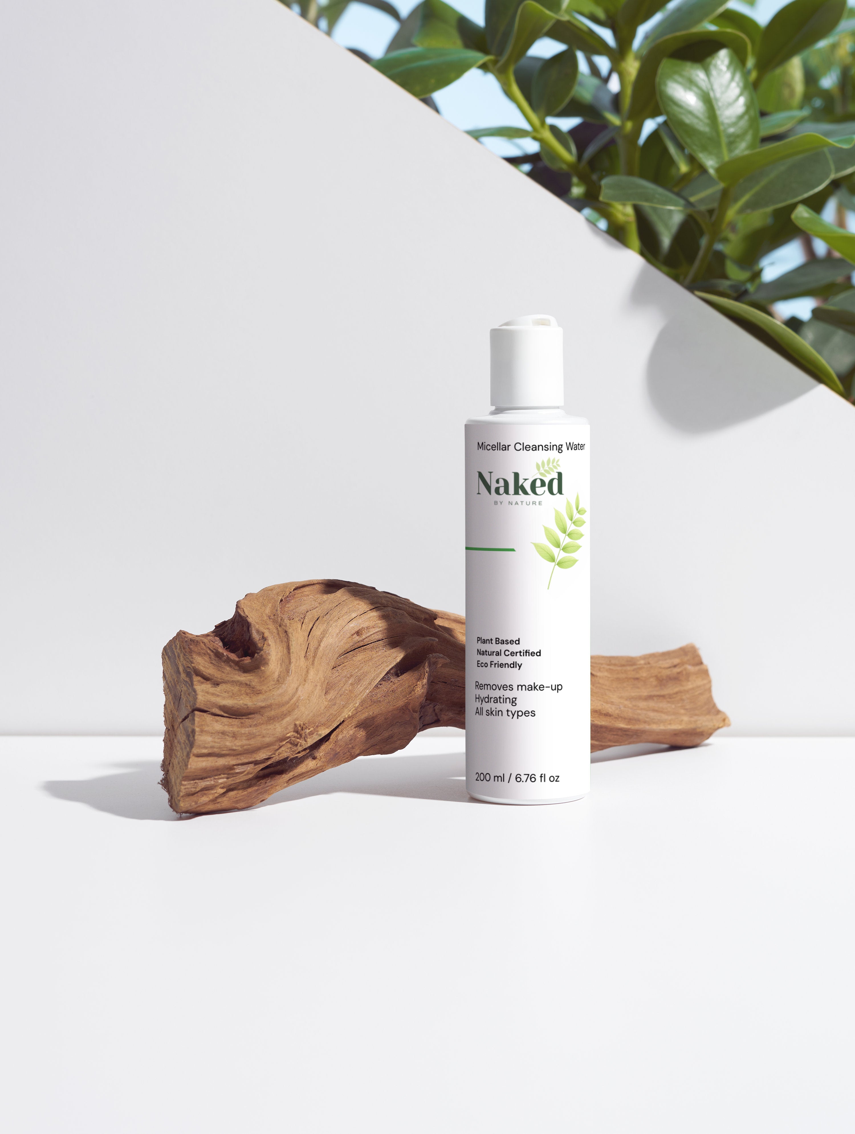 Naked by Nature Micellar Cleansing Water, plant-based, eco-friendly, hydrating for all skin types, with driftwood and green leaves